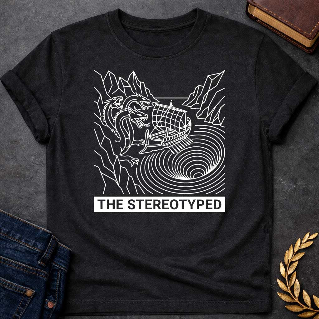Black t-shirt with A clean, line art t-shirt design. Rendered in white line work, an ancient Greek galley ship navigates between a three-headed sea monster on jagged cliffs and a concentric, swirling whirlpool. Below the graphic, a solid dark blue rectangular banner features white, sans-serif block text that reads "THE STEREOTYPED".