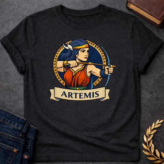 Black T-shirt graphic featuring a vibrant illustrated portrait of Artemis, the Greek Goddess of the Hunt, with long dark blue hair and a gold headband adorned with a white crescent moon, wearing a red and blue draped gown with a green belt, drawn back in a dynamic archery pose with a bow and arrow aimed forward. She is framed within a gold circular border against a navy background, with a scroll banner below reading "Artemis," in a bold tattoo-inspired style with navy, gold, and red tones