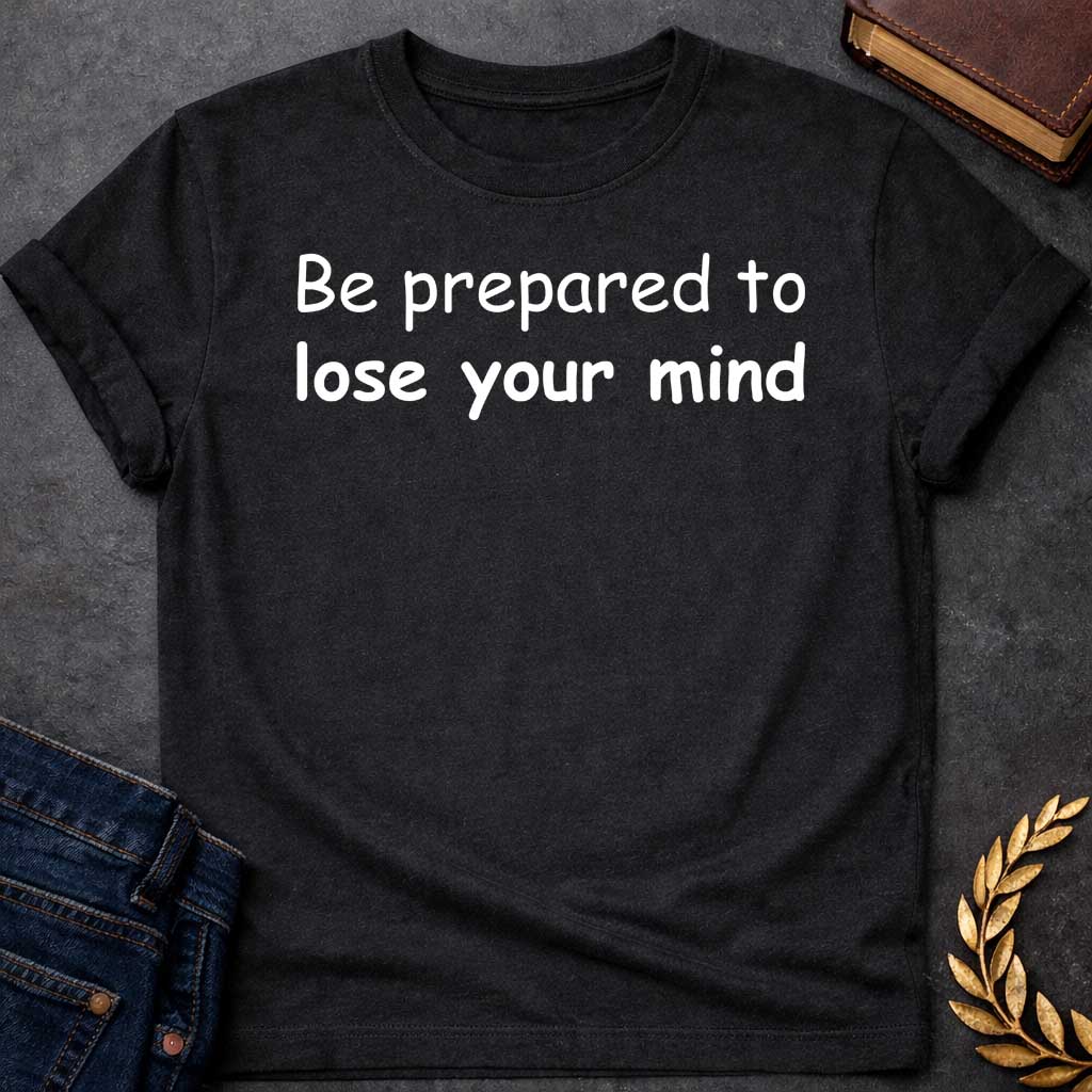 Black T-shirt graphic white text featuring large rounded friendly sans-serif text reading "Be prepared to lose your mind" — a humorous warning referencing Dionysus, the Greek God of Wine and Madness, whose worship was associated with ecstatic frenzy and altered states