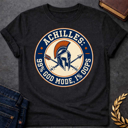 Black T-Shirt with a circular badge design in navy blue, cream, and burnt orange featuring a Greek Corinthian helmet with orange horsehair crest, crossed by two arrows. Styled like a vintage achievement badge. Text reads 'ACHILLES:' at top, '99% GOD MODE, 1% OOPS' at bottom. Humorously references Achilles and his famous vulnerability—his heel—suggesting he was nearly invincible (99% in 'god mode') except for one fatal weakness (1% 'oops'). Distressed, retro aesthetic mimics vintage sports or gaming badges.