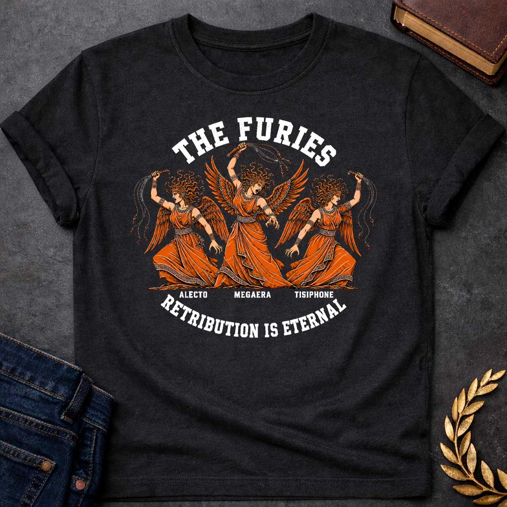 Black T-shirt with an Illustration of the three Furies, the Greek goddesses of vengeance. Three winged female figures with serpent hair wear orange draped robes with Greek key patterns. Each carries whips as instruments of punishment. Named left to right: Alecto, Megaera, and Tisiphone. Rendered in black and orange with classical details. Text reads 'THE FURIES' above and 'RETRIBUTION IS ETERNAL' below, celebrating divine justice and eternal consequences for wrongdoing.