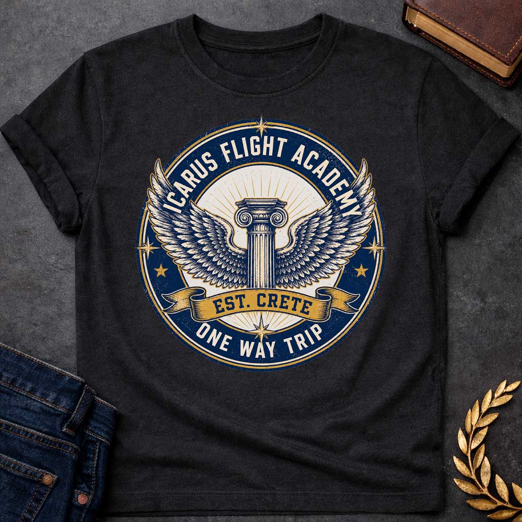 Black t-shirt A circular, distressed vintage emblem design. At the center of a cream circle, a classic Greek Ionic column sprouts a large pair of detailed, spreading wings. A dark blue outer ring features the text "ICARUS FLIGHT ACADEMY" at the top and "ONE WAY TRIP" at the bottom. A golden banner across the center reads "EST. CRETE," adding a dark humor twist to the mythological flight.