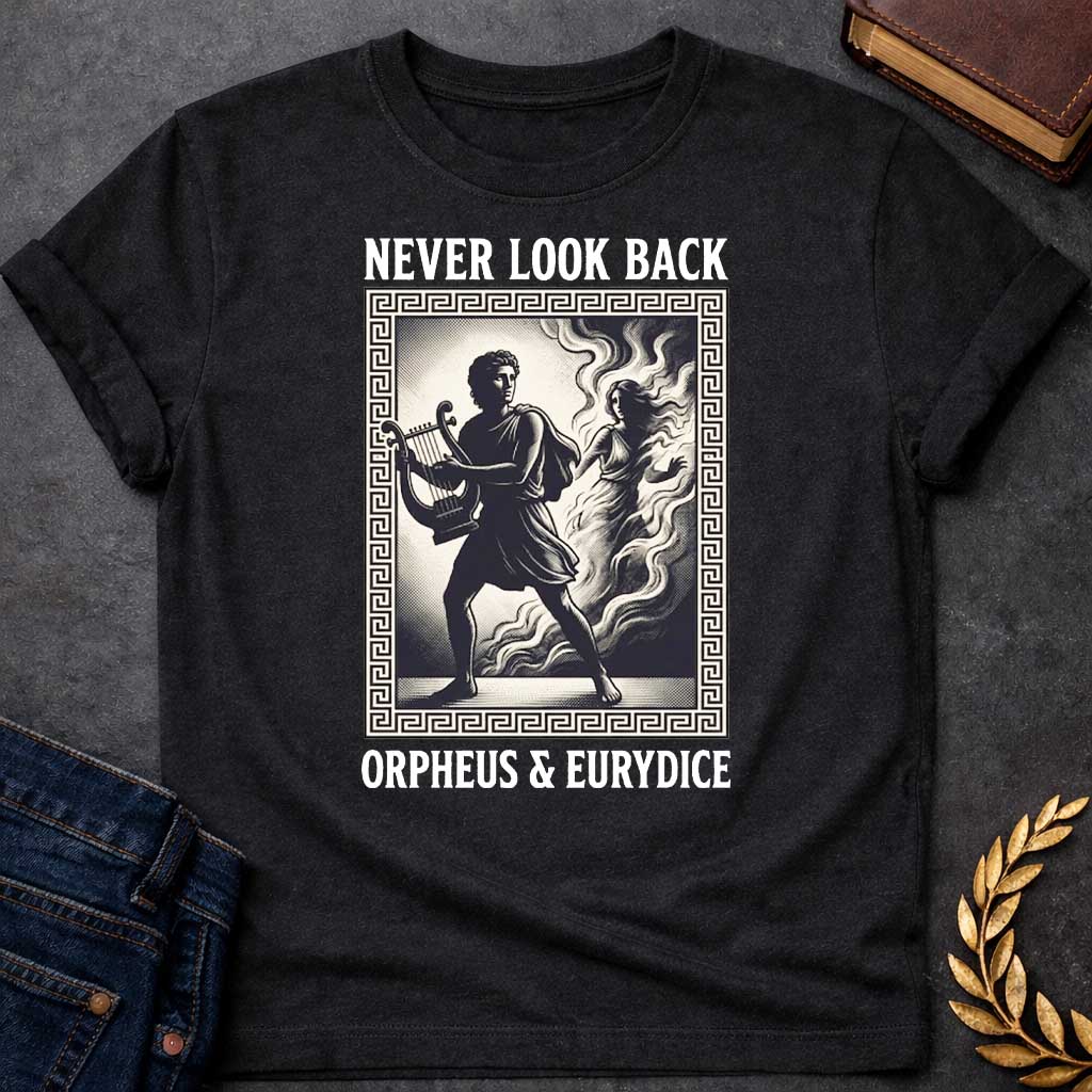 Black t-shirt in engraved woodcut style: Orpheus strides forward carrying a lyre while Eurydice dissolves into smoke and shadow behind him, reaching out. The scene sits within a Greek key-patterned rectangular border, framed by bold serif text above and below, on a cream and black palette.