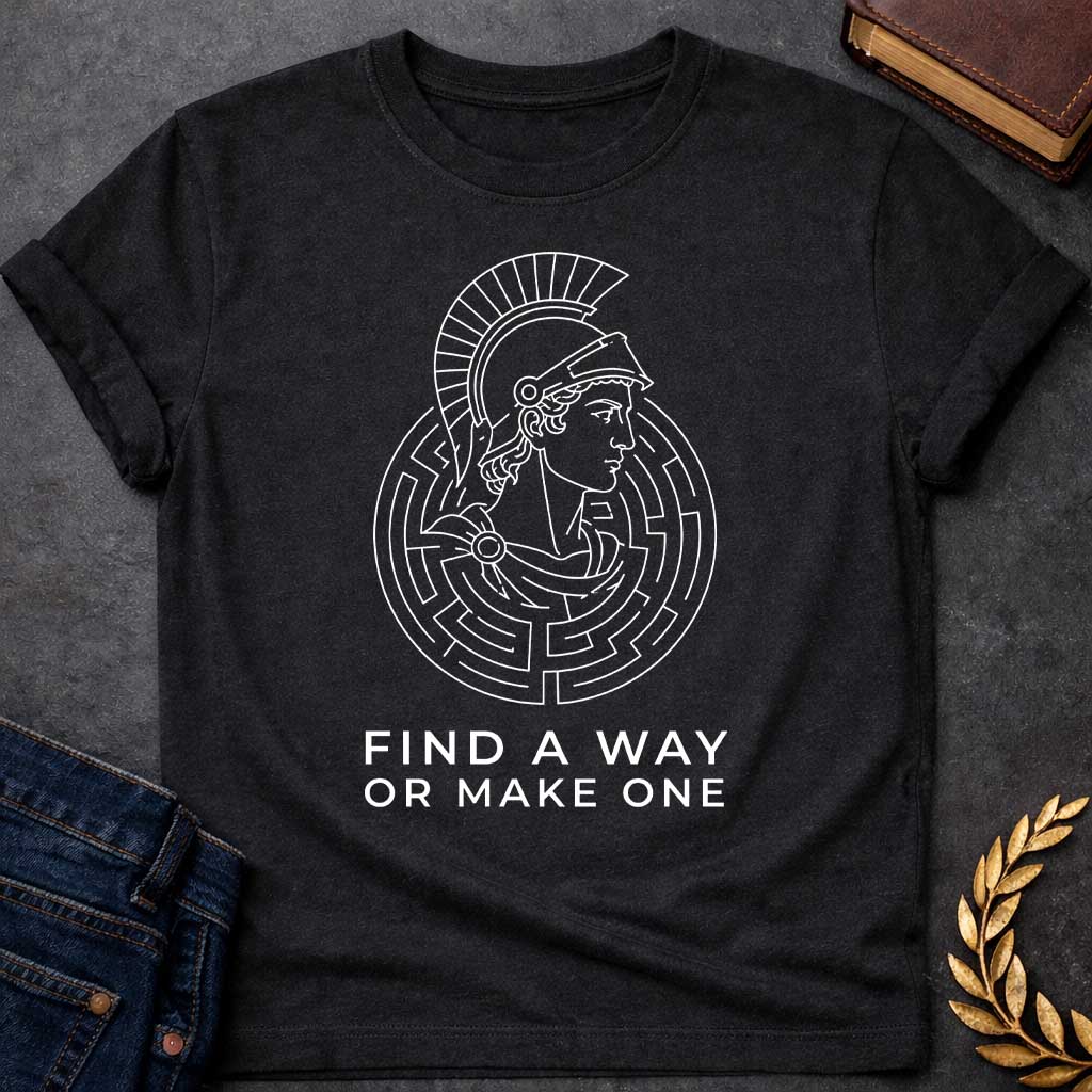 Black T-shirt with A Classical profile of a Spartan warrior wearing a crested Corinthian helmet, surrounded by concentric circular maze patterns forming an intricate labyrinth. Black and white line art style. Text reads 'Find A Way Or Make One' below. Motivational design celebrating determination, problem-solving, and perseverance. References Theseus's escape from the mythological Cretian labyrinth while embodying warrior resilience and grit.