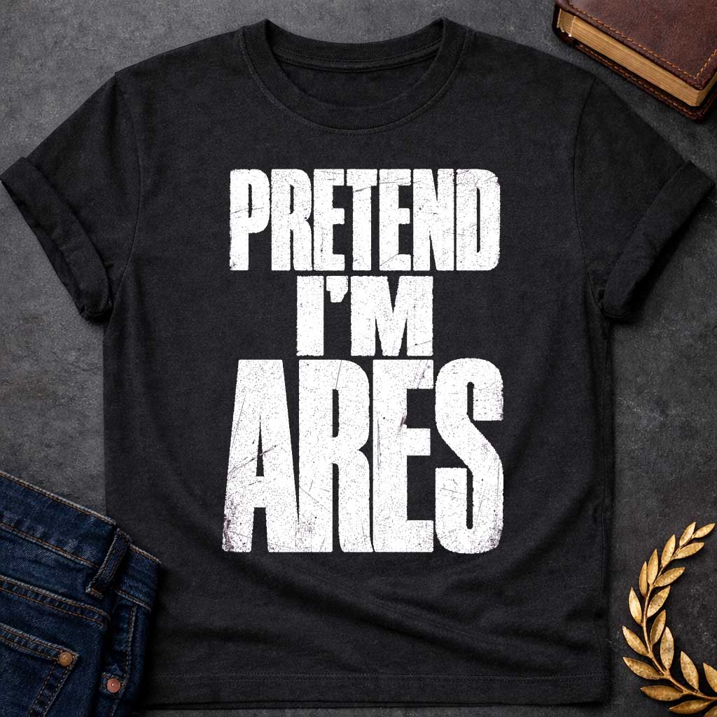Black t-shirt with a Pretend I’m Ares Greek mythology design featuring bold distressed white typography on a transparent background. The stacked text reads “PRETEND I’M ARES” in a rugged vintage block font, creating a humorous Greek god design inspired by Ares, the god of war, courage, battle, and martial strength.