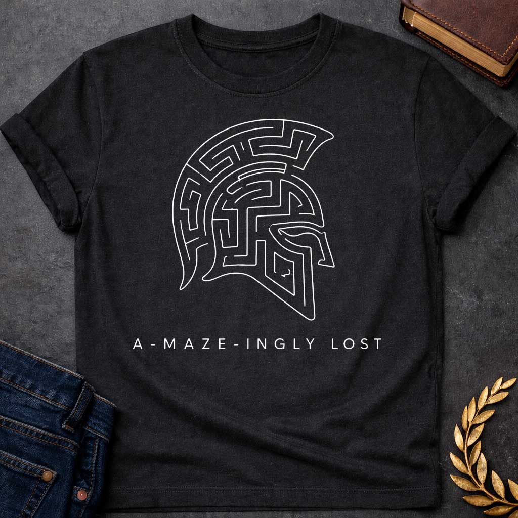 Black T-shirt with A Minimalist line art Spartan warrior helmet composed entirely of intricate maze pathways on a shirt. The crested helmet's interior is filled with convoluted corridors and passages forming a complex labyrinth design. Black and white aesthetic. Text reads 'A-Maze-Ingly Lost' below. Clever wordplay merges Greek mythology and warrior symbolism with the legendary Cretian labyrinth, celebrating getting lost in mazes and ancient Greek warrior culture.