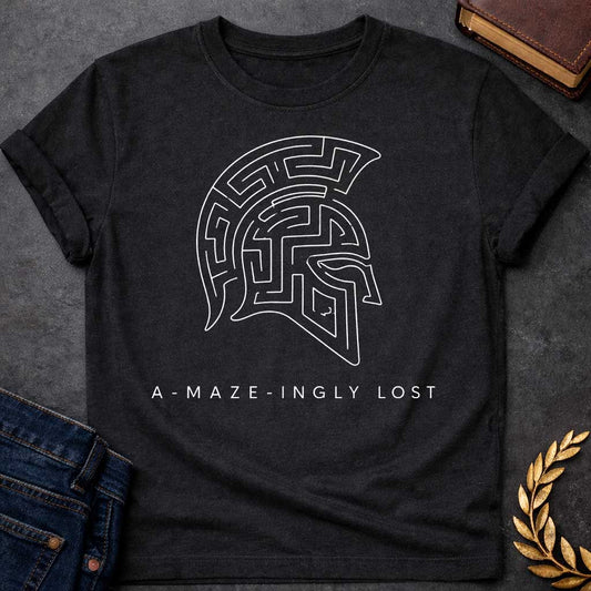 Black T-shirt with A Minimalist line art Spartan warrior helmet composed entirely of intricate maze pathways on a shirt. The crested helmet's interior is filled with convoluted corridors and passages forming a complex labyrinth design. Black and white aesthetic. Text reads 'A-Maze-Ingly Lost' below. Clever wordplay merges Greek mythology and warrior symbolism with the legendary Cretian labyrinth, celebrating getting lost in mazes and ancient Greek warrior culture.