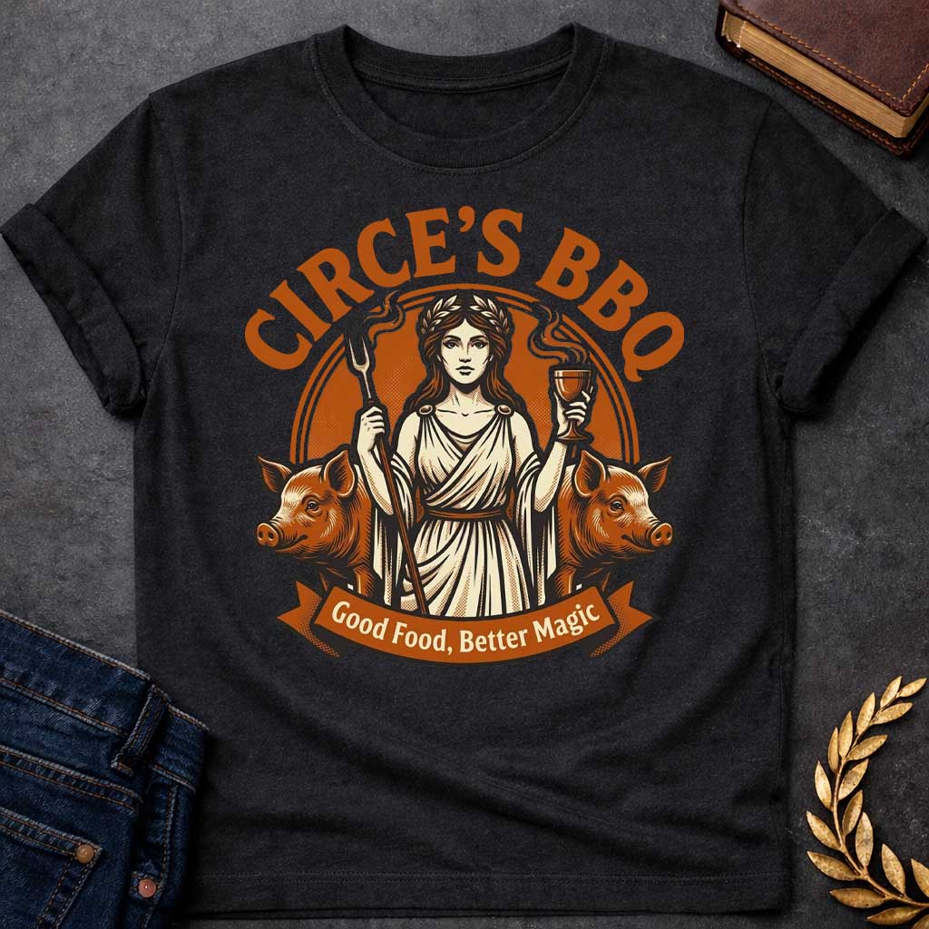 Black T-shirt with a Humorous BBQ restaurant emblem featuring Circe from Greek mythology in classical robes. She holds a trident fork and wine goblet. Two pigs flank her sides, representing her legendary power to transform men through magic and enchantment. Brown and cream aesthetic. Text reads 'Circe's BBQ' and 'Good Food, Better Magic.' Clever wordplay merges ancient witchcraft with modern barbecue culture and humorous transformation themes.