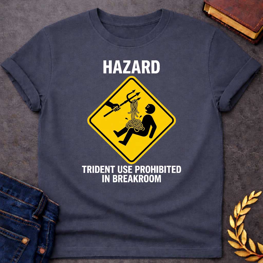 Dark Heather T-Shirt with a humorous design featuring a bold, yellow, diamond-shaped warning sign. Inside the sign, a stick figure falls backward, looking shocked as a pile of tangled yellow spaghetti spills from their chest and stomach. Above them, an outstretched black silhouette of a hand holds a trident, which has a forkful of the spaghetti tangled in its tines, appearing to have just pulled the pasta away. Above the sign, the word "HAZARD" is printed in large, white, block letters. Below the sign, the 