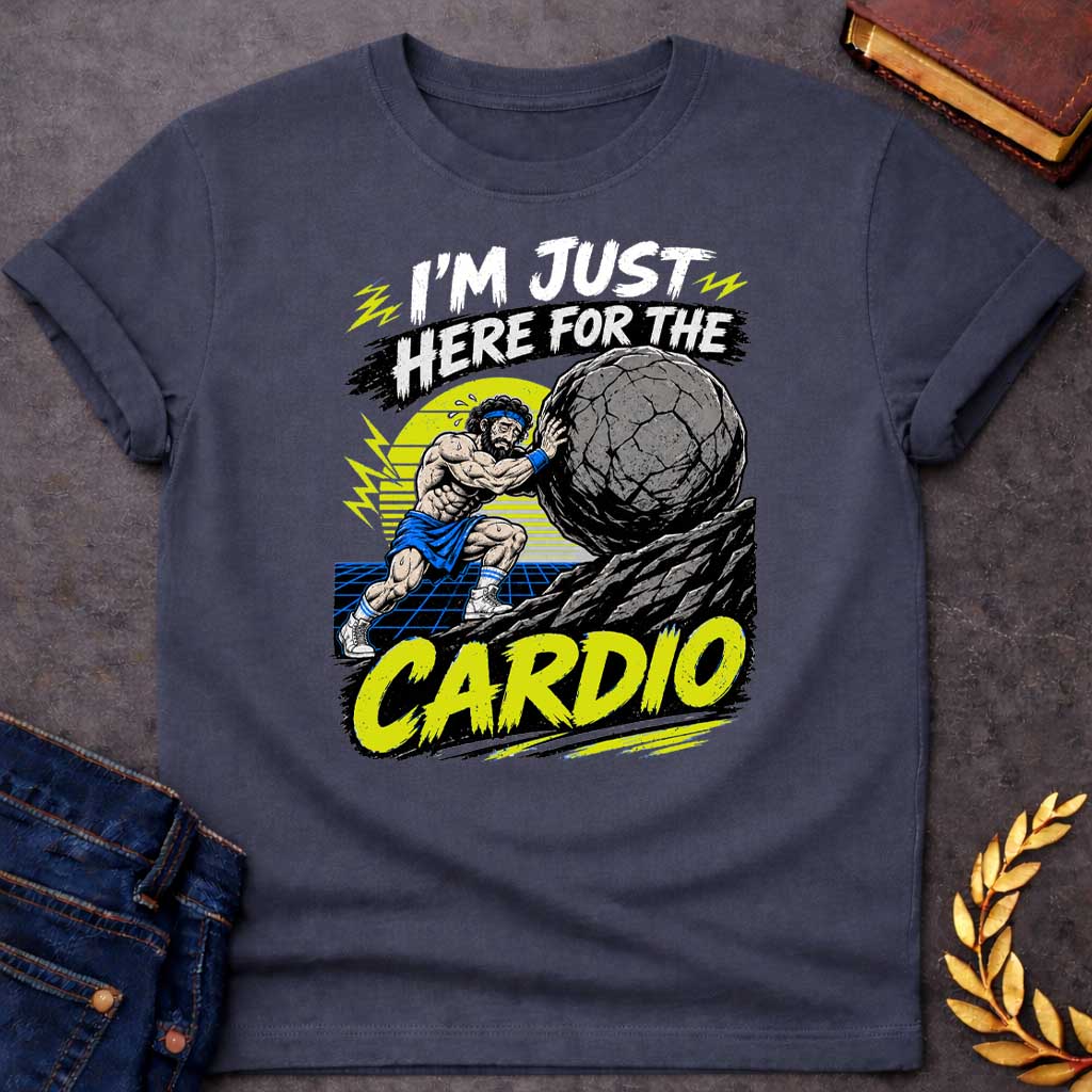 Dark Heather T-Shirt with a graphic design featuring a stylized, sweating Sisyphus pushing a massive boulder up a rocky incline. He is wearing gym attire, including a sweatband and high-top sneakers, set against a retro-themed backdrop with a yellow sun and a blue grid landscape. The text "I'M JUST HERE FOR THE" appears at the top in a distressed, brush-stroke style, and the word "CARDIO" is prominently displayed at the bottom in a bold, bright yellow, brush-stroke font