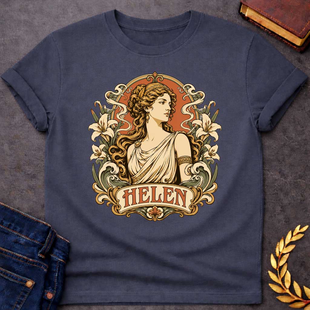 Dark Heather T-shirt with an Art Nouveau style t-shirt graphic featuring a profile portrait of Helen of Troy. She has flowing wavy hair, a gold headband, and an elegant cream-colored Greek chiton. The design is framed by an ornate, vintage border decorated with blooming white lilies and flowing ribbons. At the bottom, an elegant banner displays the name "HELEN" in an antique font, featuring a warm terracotta and muted green color palette