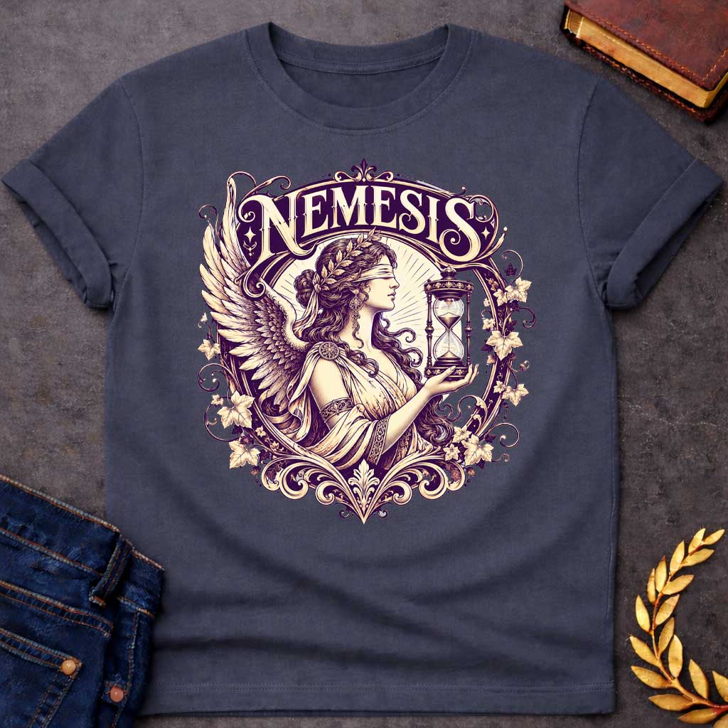 Dark Heather T-shirt with an Ornate Victorian-style illustration of Nemesis, the Greek goddess of divine retribution, rendered in purple and cream. She wears an ornate headband, flowing robes, and large detailed wings. She holds an hourglass symbolizing time and inevitability. Elaborate Art Nouveau decorative frame features scrolling flourishes, ivy leaves, and flowers surrounding the figure. Ornamental typography reads 'NEMESIS' at top in elegant serif lettering. References the goddess who ensures karmic j