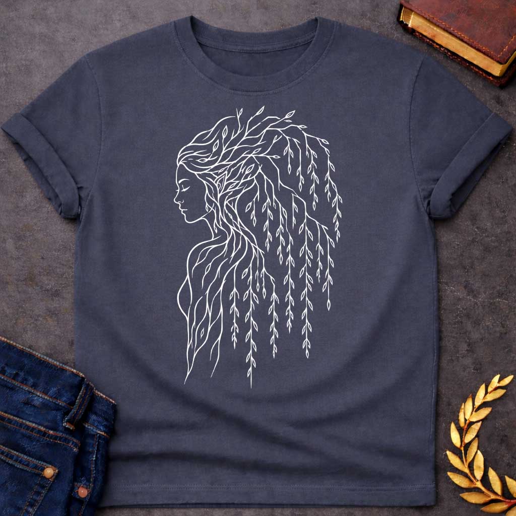 Dark Heather T-shirt with a Minimalist line art portrait of a dryad, a tree nymph from Greek mythology. A woman's profile in delicate white lines has hair composed entirely of weeping willow branches and drooping leaves cascading down her back. Individual leaves are intricately detailed, flowing gracefully like water. Simple contour drawing style emphasizes the spiritual connection between human and nature. Celebrates the mythological guardians of forests and their ethereal beauty

