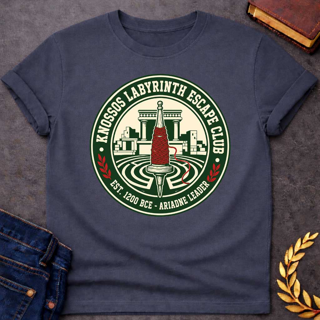Dark Heather T-shirt with A circular, collegiate-style emblem t-shirt design, The logo features a cream center showing a wooden spindle wrapped in bright red thread, positioned over a labyrinth with ancient Minoan ruins behind it. The dark green outer ring reads "KNOSSOS LABYRINTH ESCAPE CLUB" along the top and "EST. 1200 BCE - ARIADNE LEADER" at the bottom, separated by small red laurel branches.