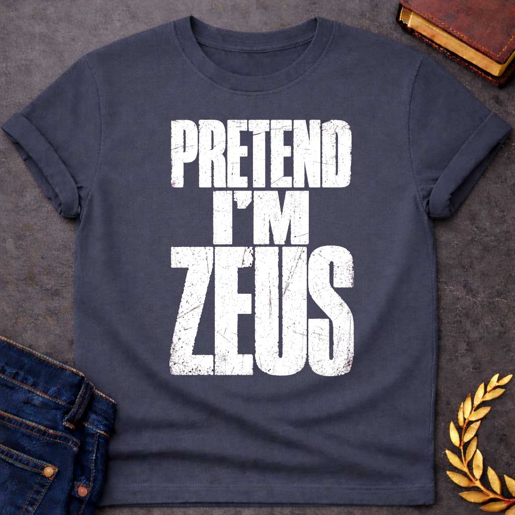 Dark Heather t-shirt with a Pretend I’m Zeus Greek mythology design featuring bold distressed white typography on a transparent background. The stacked text reads “PRETEND I’M ZEUS” in a rugged vintage block font, creating a humorous design inspired by Zeus, king of the Greek gods and god of the sky, thunder, and lightning.