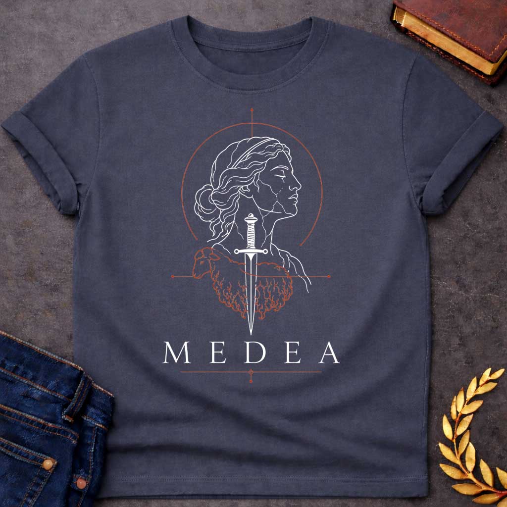 Dark Heather T-shirt with a Minimalist line art portrait of Medea in classical profile with wavy hair. A black sword pierces through her head and neck. Red geometric elements form a crown above and a coiled dragon below, symbolizing her magical power and ancient lineage. Decorative line elements complete the occult aesthetic. Text reads 'Medea' below. Stark black and red design celebrates the legendary Greek sorceress's complexity—beauty, power, and dangerous knowledge intertwined.