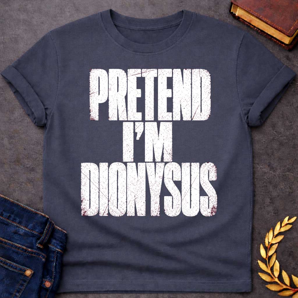 Dark Heather t-shirt with a Pretend I’m Dionysus Greek mythology  design featuring bold distressed white typography on a transparent background. The stacked text reads “PRETEND I’M DIONYSUS” in a rugged vintage block font, creating a humorous design inspired by Dionysus, the Greek god of wine, revelry, theater, festivity, and celebration.