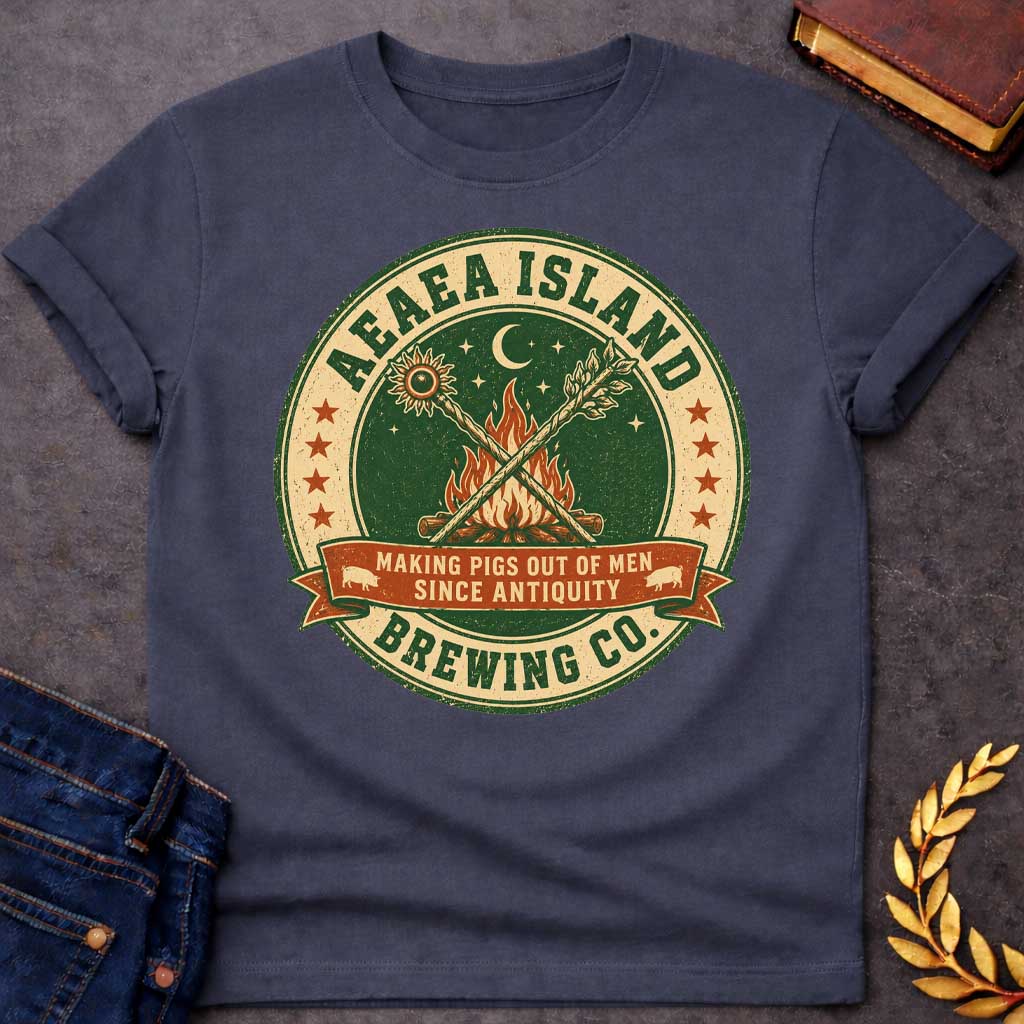 Dark heather T-shirt with a Humorous brewery emblem of Aeaea Island Brewing Co. in green and cream vintage style. A roaring campfire with crossed torches dominates the center beneath a sun, moon, and stars. Brown banner reads 'Making Pigs Out of Men Since Antiquity' flanked by small pig silhouettes. Red stars border the circular design. Distressed texture adds authentic craft brewery aesthetic. Celebrates Circe's mythological powers of transformation and enchantment with modern craft beer culture.
