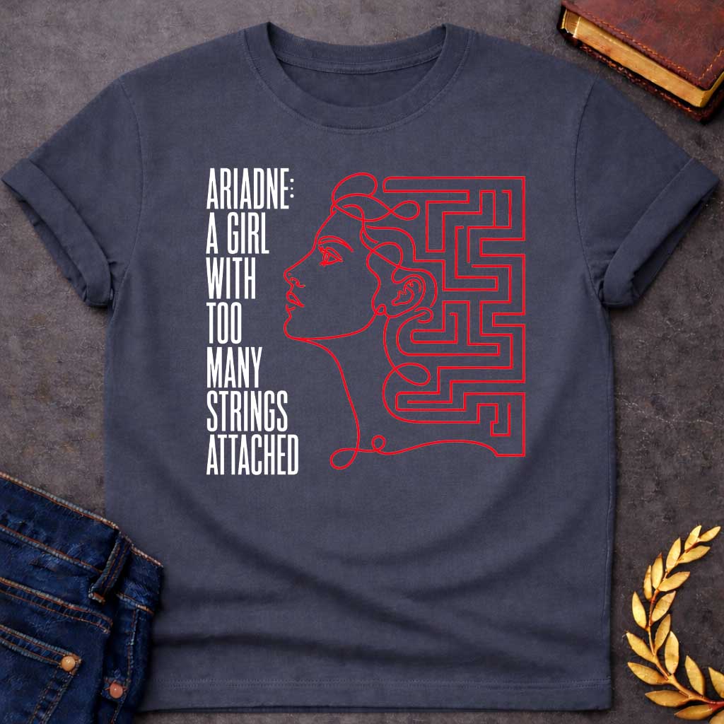 Dark Heather T-shirt with A minimalist, modern line art t-shirt design for "ariadne a girl with black.jpg". Drawn in a single, continuous red line, the profile of a woman’s face seamlessly transitions into a geometric labyrinth maze behind her head. To the left, stark, vertically elongated black block text stacked vertically reads: "ARIADNE: A GIRL WITH TOO MANY STRINGS ATTACHED," creating a clever Greek mythology pun.