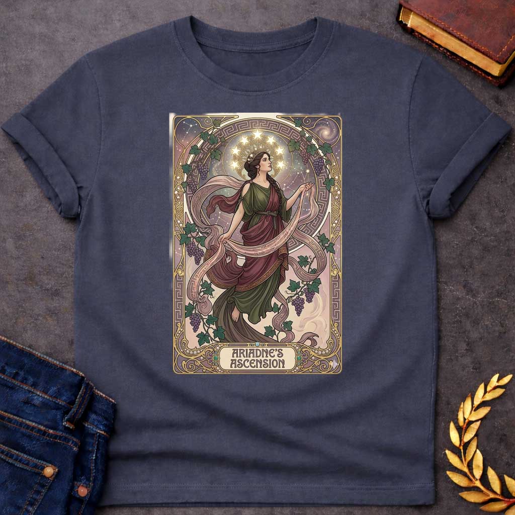 Dark Heather T-shirt with An Art Nouveau-style t-shirt graphic. Modeled like a tarot card, a graceful Greek woman floats upward, wearing a flowing green and plum gown beneath a crown of glowing stars. She is framed by an elegant, ornate golden border interwoven with purple grapevines and Greek key patterns. A decorative banner at the base displays the title "ARIADNE'S ASCENSION" in a stylized font.
