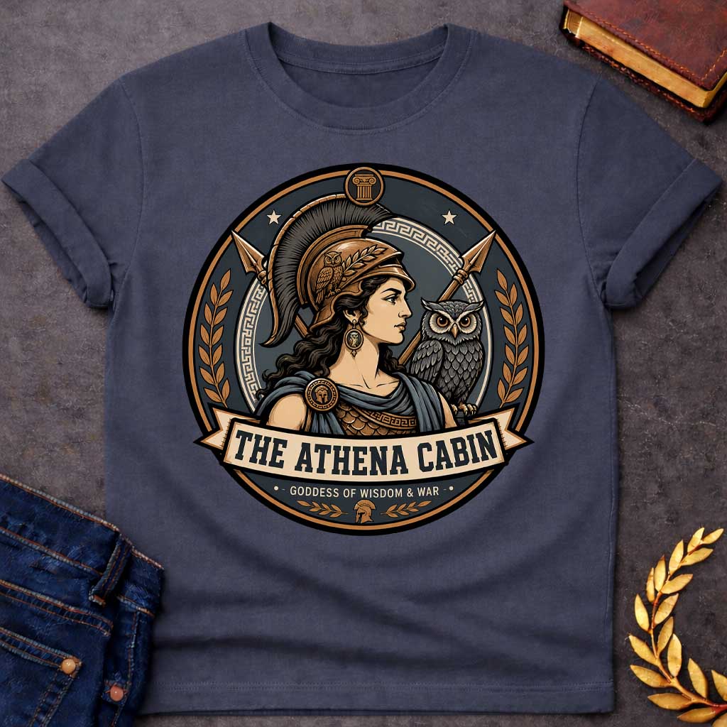 Dark Heather t-shirt with a Athena Greek mythology cabin design featuring the goddess of wisdom and war in a bronze warrior helmet, accompanied by her sacred owl and crossed spears. Bronze, charcoal, and cream circular camp-style emblem features Greek key details, laurel branches, and the text “The Athena Cabin” and “Goddess of Wisdom & War.”