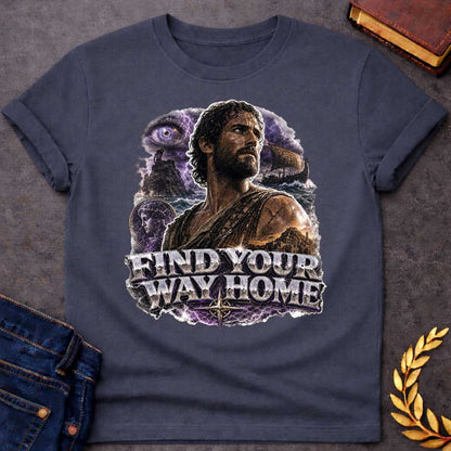 Dark Heather t-shirt with an Epic Greek mythology design featuring Odysseus against a stormy seascape with lightning, a sailing ship, ancient ruins, and a mysterious watchful eye. A portrait of a woman appears within the dramatic collage, symbolizing his journey back to Ithaca. Bold metallic lettering reads "Find Your Way Home," capturing the adventure and perseverance of The Odyssey.