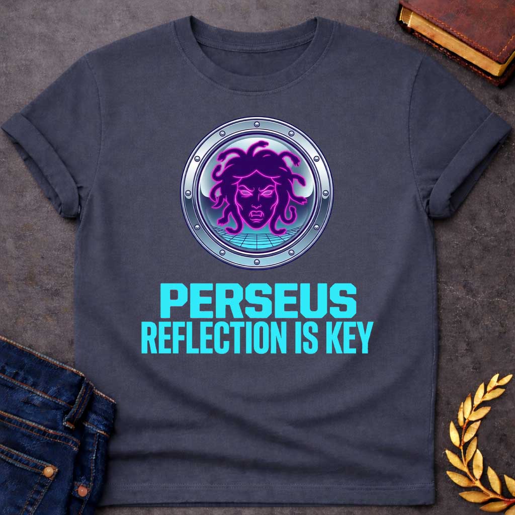 Dark Heather t-shirt in synthwave style: a glowing neon-pink and purple Medusa face with snake hair sits inside a chrome porthole frame with rivets, backed by a retro grid floor and gradient sky. Bold cyan text below reads "Perseus" and "Reflection Is Key"
