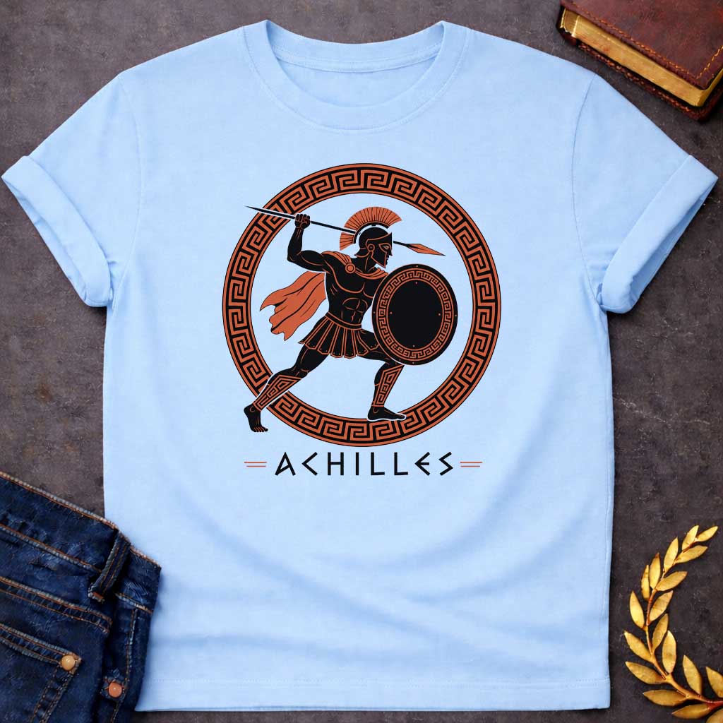 Light Blue T-Shirt with an ancient Greek red-figure pottery style illustration of Achilles in dynamic battle pose. The muscular figure is rendered in black silhouette with terracotta-orange details, wearing a crested Corinthian helmet, pleated skirt, flowing cape, and greaves. He holds a round shield with Greek key pattern and raises a spear overhead. Enclosed in a circular border with orange and black meander pattern. Below, 'ACHILLES' is written in geometric font. Evokes classical Greek pottery art.
