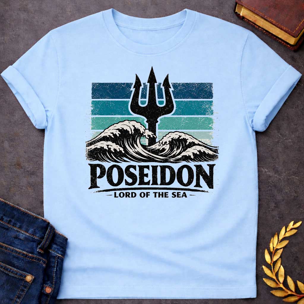 Light Blue T-Shirt A vintage-style graphic shirt design.  The central image features a distressed, black silhouette of a trident rising from the center of crashing, white-capped ocean waves. Behind the trident is a square background made of horizontal stripes in shades of blue, teal, and light seafoam, all with a heavily weathered and grainy texture. Below the waves, the name "POSEIDON" is written in large, bold, black distressed block letters. Underneath the name, the title "— LORD OF THE SEA —" is display