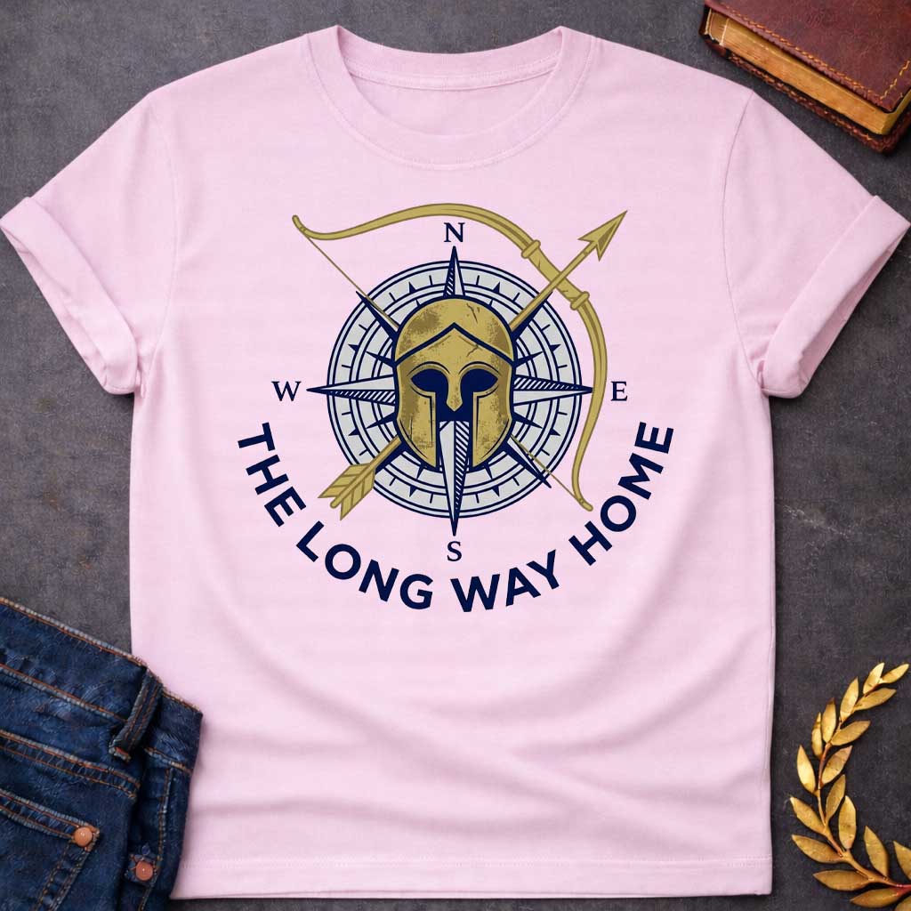 Light Pink T-Shirt with a logo design combining Greek warrior imagery with nautical navigation elements. A weathered gold Corinthian helmet overlays a navy blue and white compass rose showing cardinal directions (N, S, E, W). A golden bow and arrow cross diagonally behind. Text reading 'THE LONG WAY HOME' curves around the bottom in navy blue. References Odysseus's epic journey in Homer's Odyssey, blending ancient Greek military symbolism with maritime wayfinding to evoke adventure, perseverance, and the vo