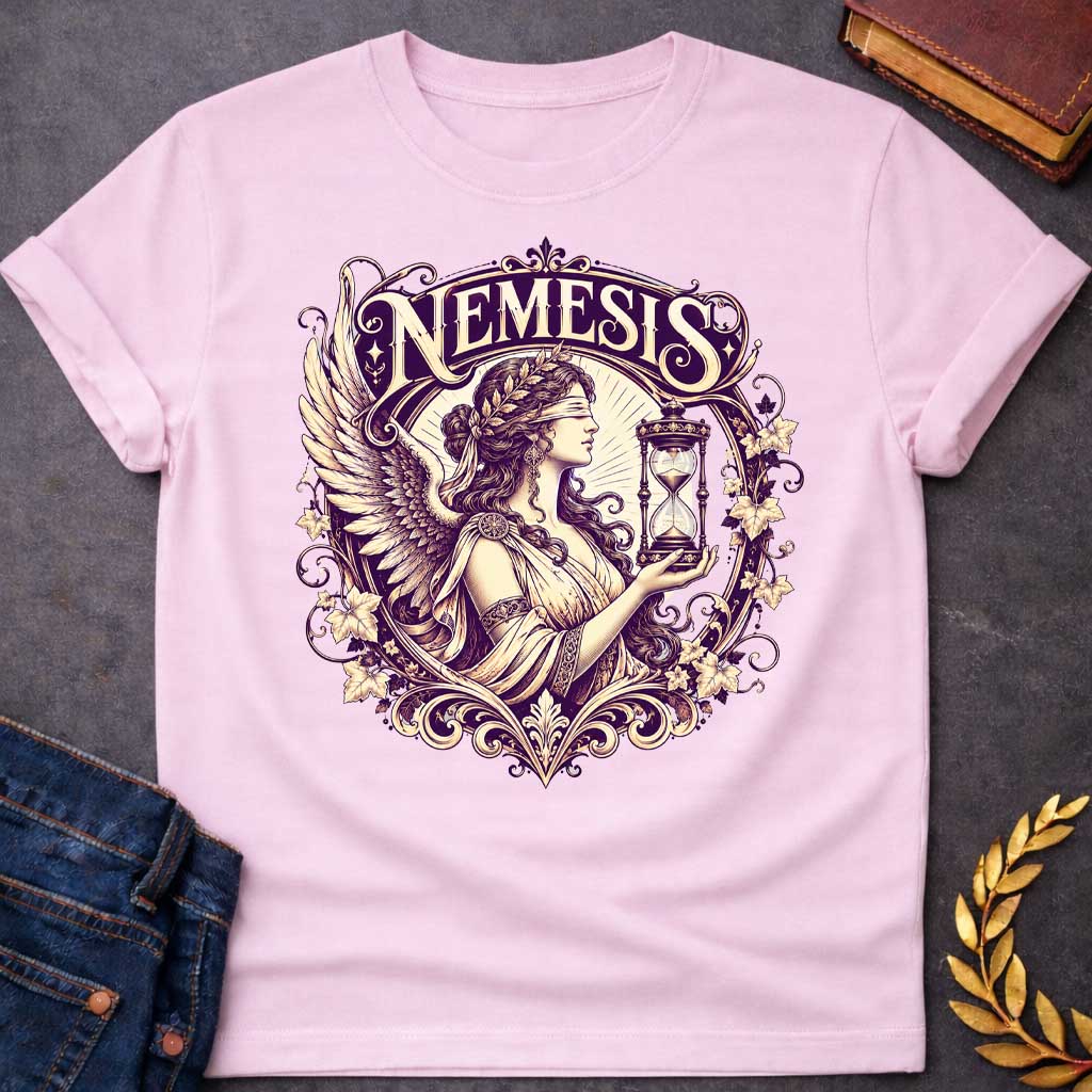 Light Pink T-shirt with an Ornate Victorian-style illustration of Nemesis, the Greek goddess of divine retribution, rendered in purple and cream. She wears an ornate headband, flowing robes, and large detailed wings. She holds an hourglass symbolizing time and inevitability. Elaborate Art Nouveau decorative frame features scrolling flourishes, ivy leaves, and flowers surrounding the figure. Ornamental typography reads 'NEMESIS' at top in elegant serif lettering. References the goddess who ensures karmic jus