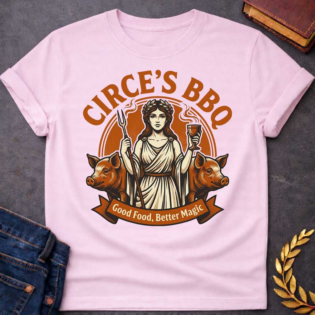 Light Pink T-shirt with a Humorous BBQ restaurant emblem featuring Circe from Greek mythology in classical robes. She holds a trident fork and wine goblet. Two pigs flank her sides, representing her legendary power to transform men through magic and enchantment. Brown and cream aesthetic. Text reads 'Circe's BBQ' and 'Good Food, Better Magic.' Clever wordplay merges ancient witchcraft with modern barbecue culture and humorous transformation themes.