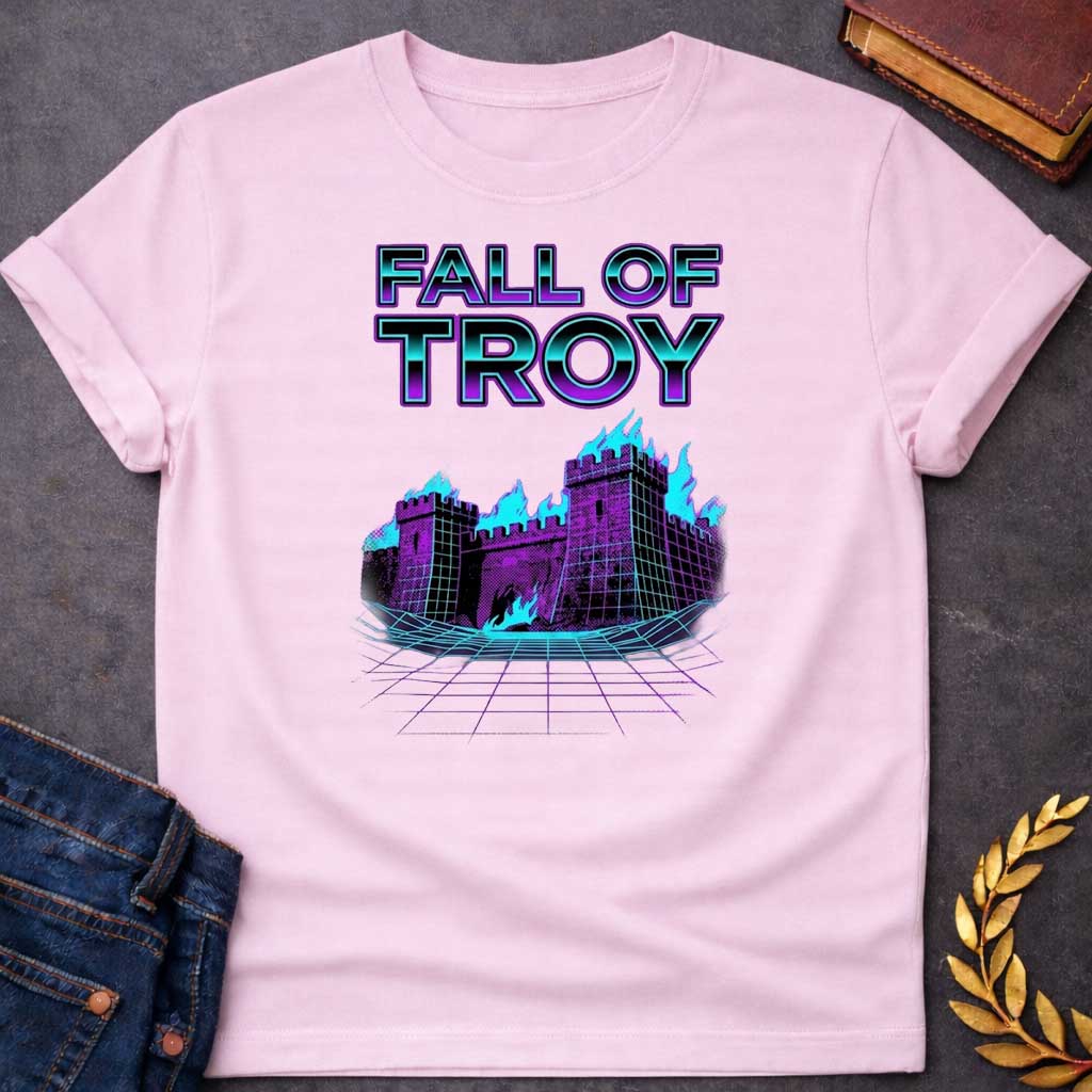 Light Pink T-shirt featuring bold chrome 3D outlined text reading "Fall of Troy" above a retro vaporwave-style illustration of the burning city of Troy depicted as a purple halftone castle engulfed in bright teal flames, set on a glowing teal perspective grid floor — referencing the legendary fall of Troy from Greek mythology, rendered in a vivid 1980s retro synthwave aesthetic in purple and teal tones