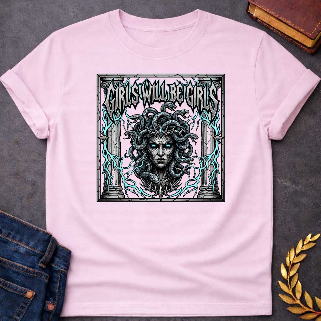 Light Pink T-shirt graphic in a dark heavy metal style featuring a fierce front-facing illustration of Medusa with glowing teal eyes, a spiked crown, and writhing snakes for hair, surrounded by electric teal lightning bolts and flanked by cracked stone Greek columns, all within a crumbling stone frame. Bold metallic gothic lettering across the top reads "Girls Will Be Girls,"