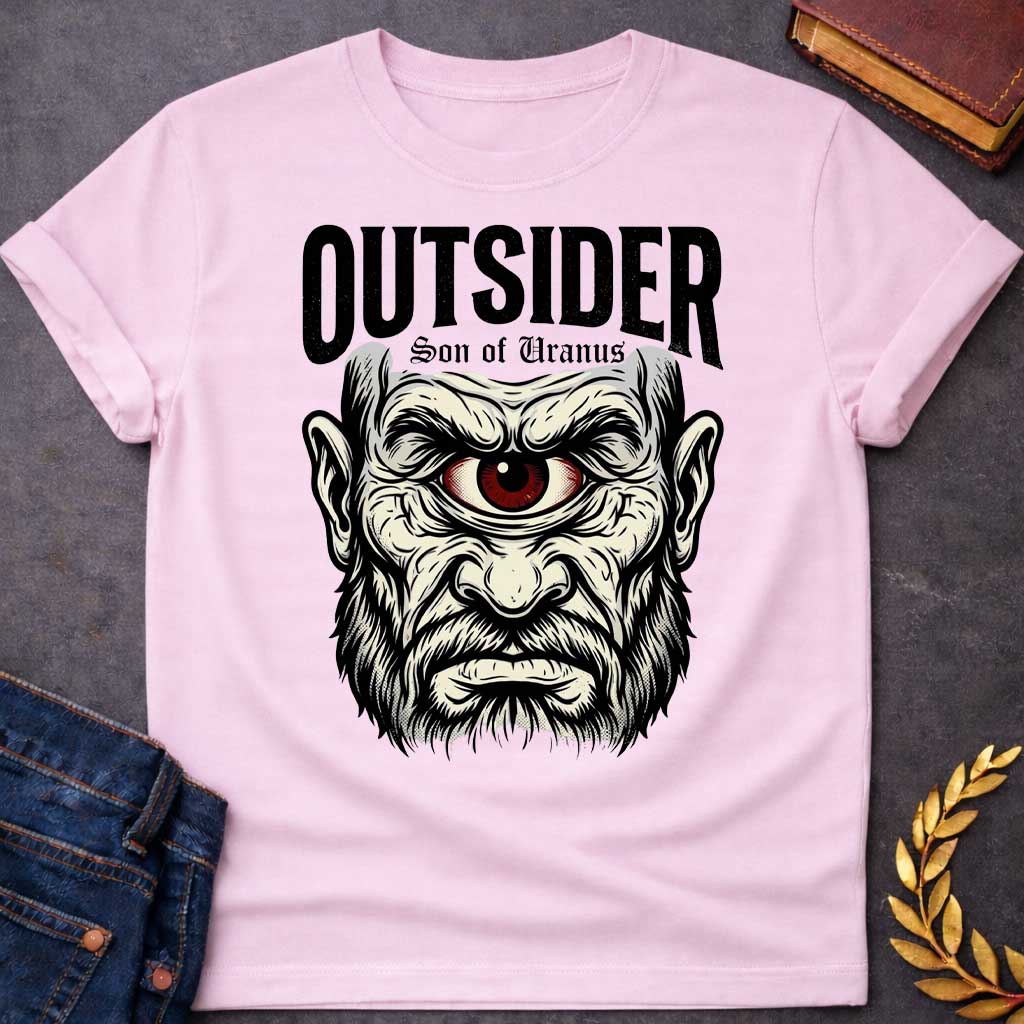 Light Pink T-shirt with a Bold typography design featuring a single-eyed Titan face with fierce expression. Thick white beard and long flowing hair frame a menacing red eye with intense gaze. Black and white engraving style with intricate line work emphasizing the character's otherworldly nature. Text reads 'OUTSIDER' and 'Son of Uranus' referencing the Titans of Greek mythology. Celebrates mythological outsider status, divine rebellion, and powerful, untamed forces beyond mortal comprehension.