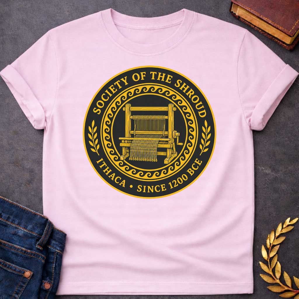 Light Pink T-Shirt with a circular emblem in gold and black featuring a detailed weaving loom at the center with partially woven fabric. Enclosed by a decorative wave pattern border. Text reads 'SOCIETY OF THE SHROUD' around the top arc, with 'ITHACA • SINCE 1200 BCE' along the bottom. Wheat sheaf motifs flank either side. References Penelope's famous shroud-weaving from Homer's Odyssey, styled as a formal organizational seal with classical Greek design elements.