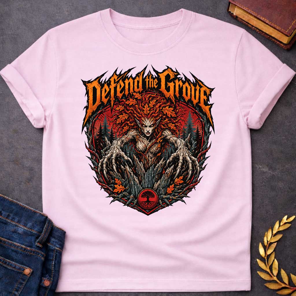 Light Pink T-shirt with a heavy metal style t-shirt graphic featuring an aggressive, monstrous dryad in a dark forest. She has fiery red and orange autumn leaf hair and sharp, root-like claws extending forward. Above the central circular graphic, the phrase "Defend the Grove" is written in a jagged, spiky orange death metal font. A small circular tree icon rests at the bottom center of the intense design