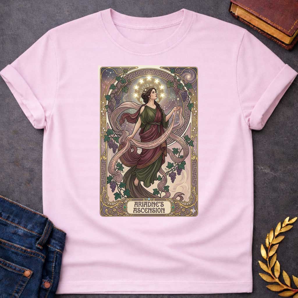 Light Pink T-shirt with An Art Nouveau-style t-shirt graphic. Modeled like a tarot card, a graceful Greek woman floats upward, wearing a flowing green and plum gown beneath a crown of glowing stars. She is framed by an elegant, ornate golden border interwoven with purple grapevines and Greek key patterns. A decorative banner at the base displays the title "ARIADNE'S ASCENSION" in a stylized font.
