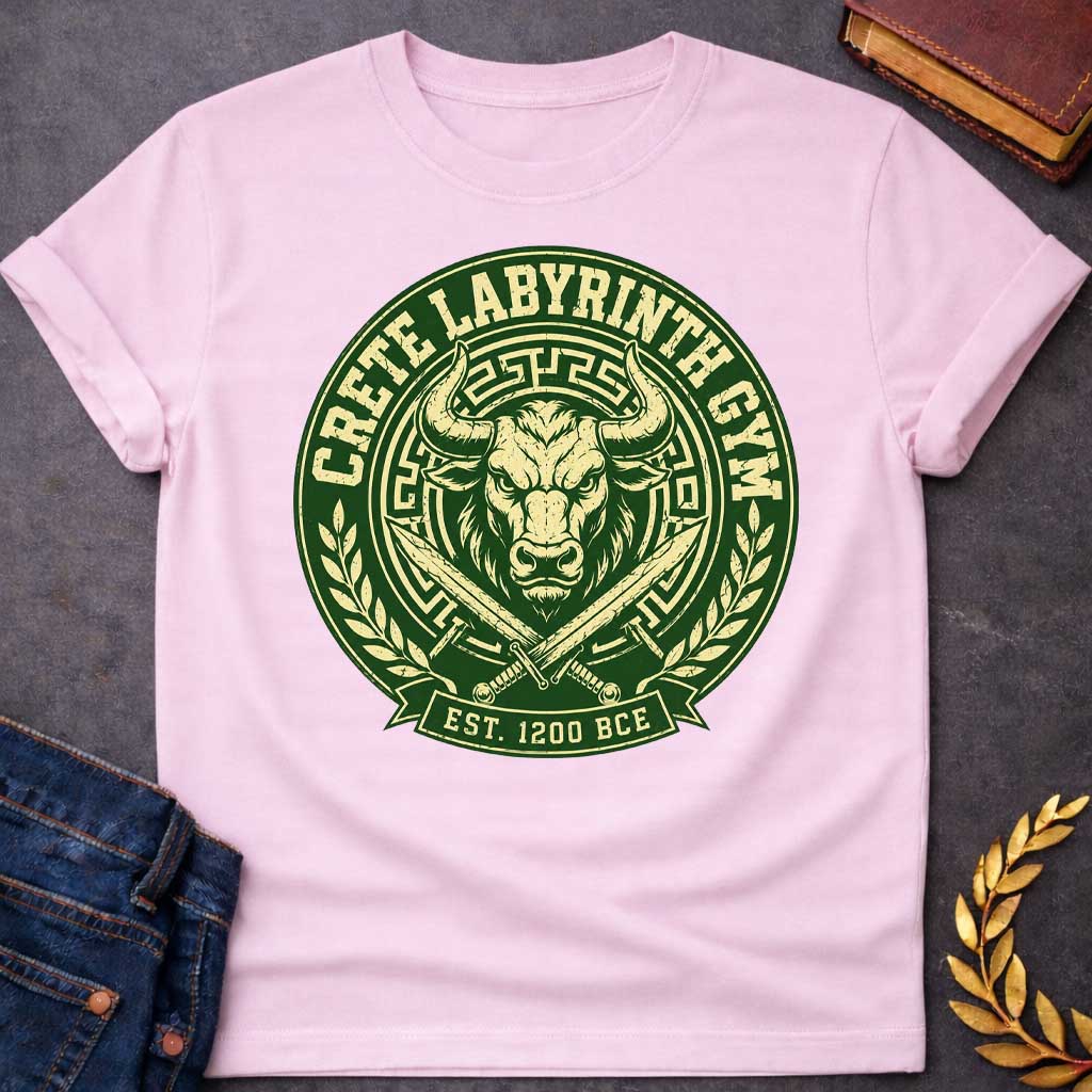 Light Pink T-shirt with a Fitness emblem of the Minotaur from Crete's Labyrinth. Green and cream circular badge displays a detailed bull head with curved horns within Greek key borders. Two crossed swords flank below. Laurel wreaths frame sides. Text reads 'Crete Labyrinth Gym' and 'Est. 1200 BCE.' Distressed texture adds vintage appeal. Merges Greek mythology with modern gym culture, celebrating legendary warrior strength.