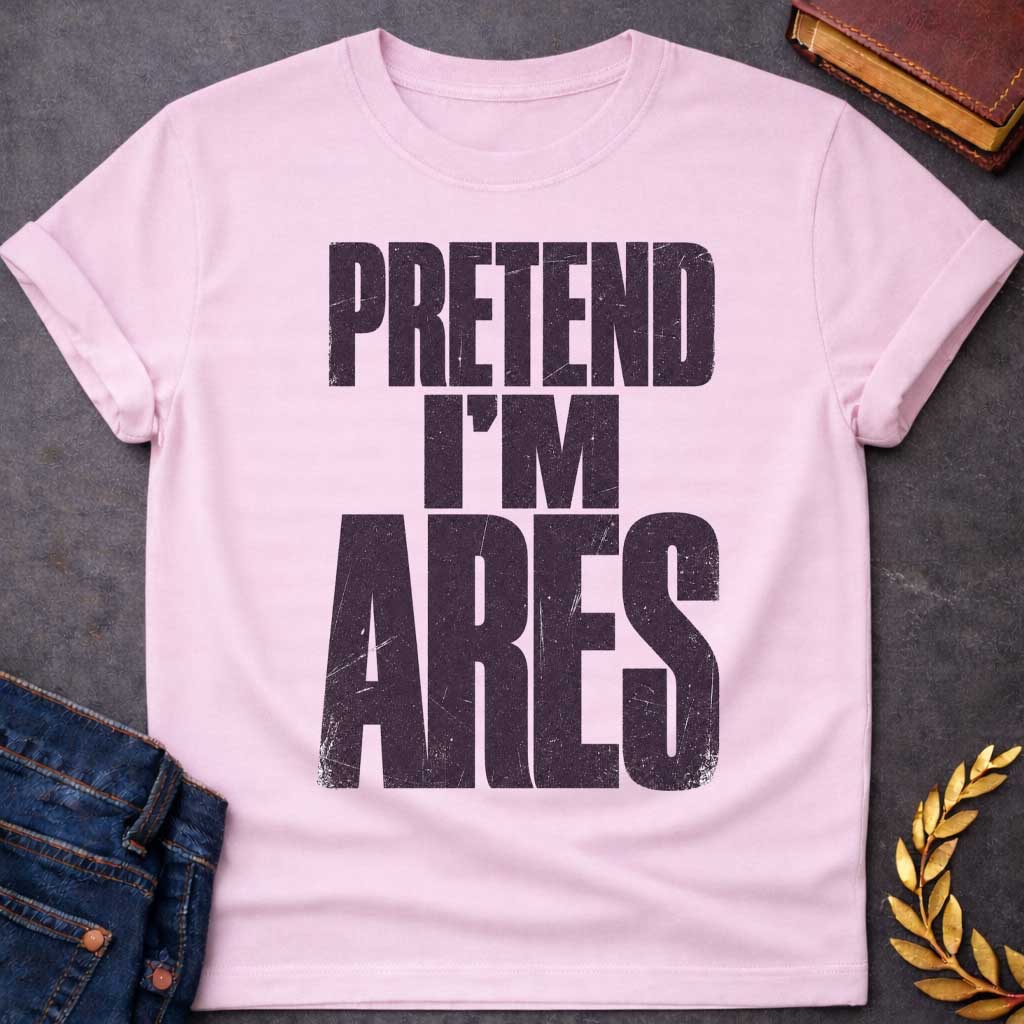 Light Pink t-shirt with a Pretend I’m Ares Greek mythology design featuring bold distressed purple typography on a transparent background. The stacked text reads “PRETEND I’M ARES” in a rugged vintage block font, creating a humorous Greek god design inspired by Ares, the god of war, courage, battle, and martial strength.