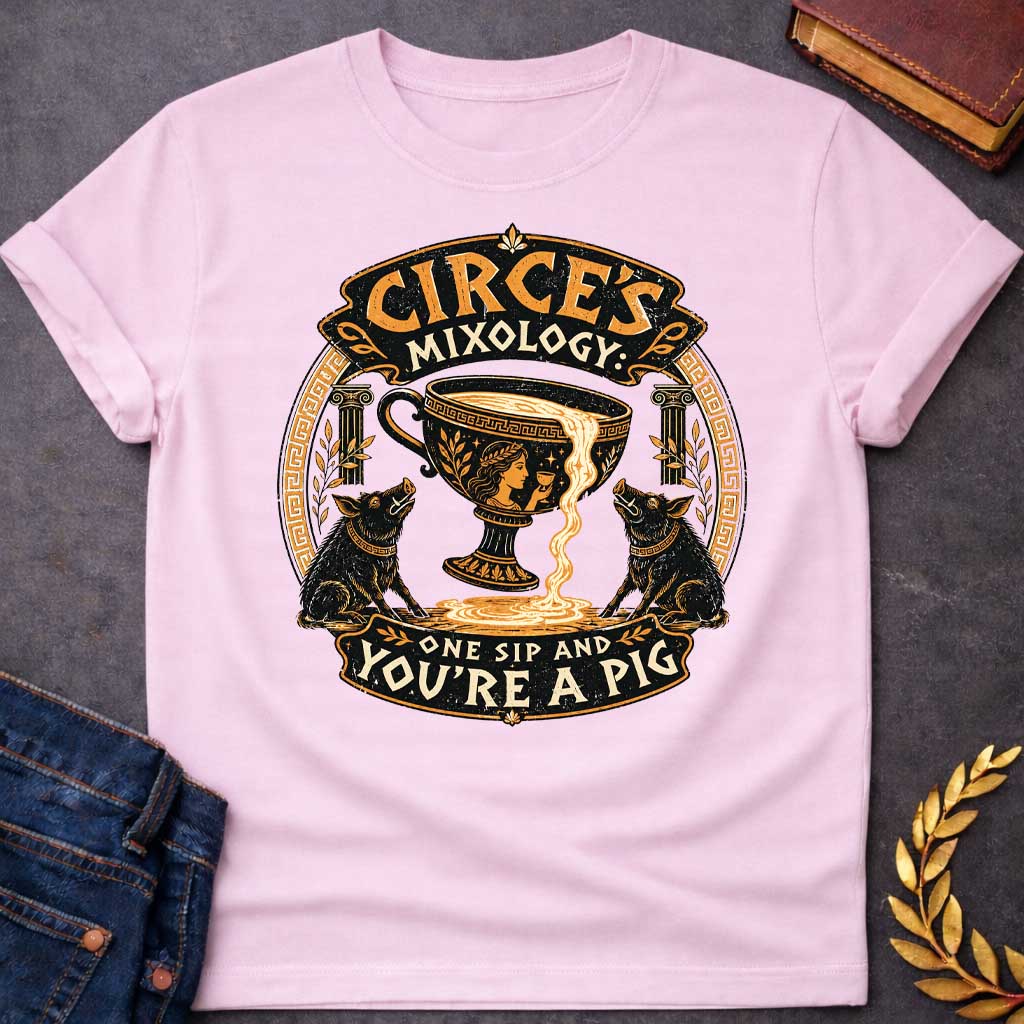 Light Pink T-shirt with a vintage-style Greek mythology t-shirt design Centered is a large black and gold ancient Greek kylix cup spilling a potion, flanked by two black pigs. At the top, stylized text reads "CIRCE'S MIXOLOGY" in an ornate banner. Below, the warning "ONE SIP AND YOU'RE A PIG" curves along the bottom. The entire circular graphic features a distressed texture with traditional Greek key patterns