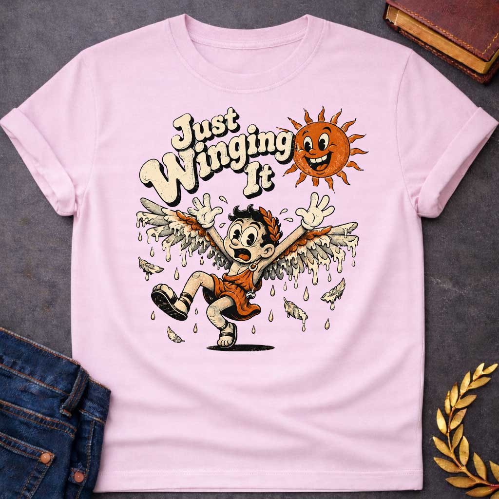 Light Pink t-shirt with a vintage 1930s rubber-hose cartoon style  design. A panicked boy representing Icarus tumbles through the air with arms raised as his feathered wax wings melt into dripping drops. Above him, a cheerful retro sun character grins mischievously next to playful, bubbly text that reads "Just Winging It" in a distressed cream font.