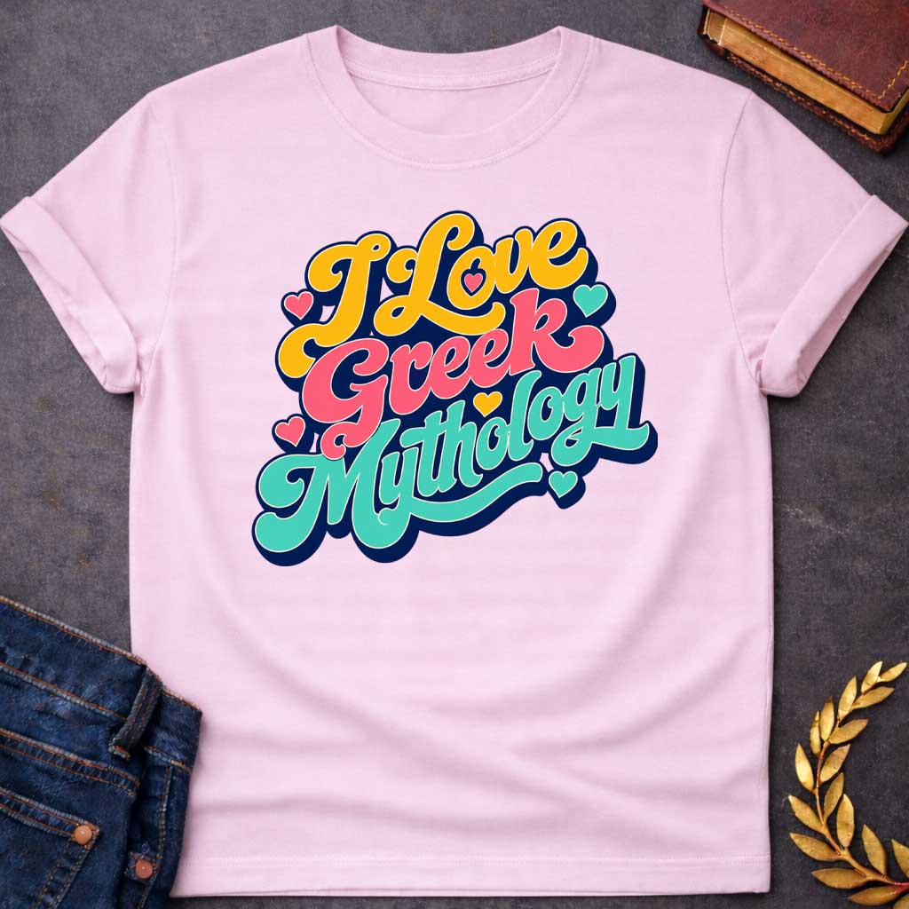 Light Pink t-shirt with a Colorful retro typography design featuring the phrase "I Love Greek Mythology" in bold, flowing script. Bright yellow, coral pink, and turquoise lettering is layered over a dark navy outline and surrounded by playful heart accents. The vibrant vintage-inspired design celebrates a love of Greek myths, gods, goddesses, heroes, and ancient legends.