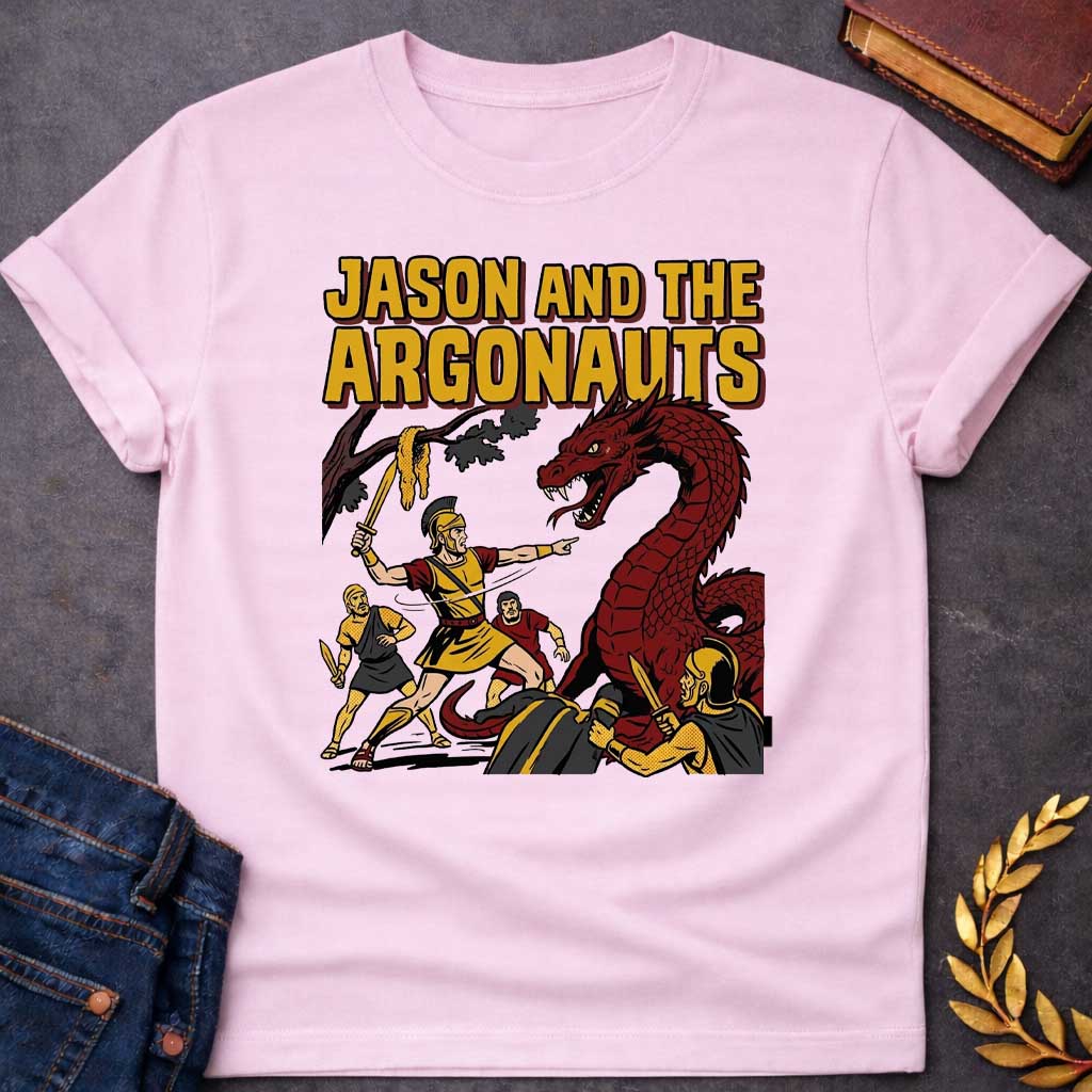 Light Pink T-shirt with A retro comic book style t-shirt design.  Bold yellow pop-art text at the top reads "JASON AND THE ARGONAUTS". Below, a Greek warrior in armor raises a sword near the Golden Fleece hanging from a tree branch, pointing toward a giant, snarling red dragon. Three fellow Argonauts surround the beast with swords drawn, featuring classic comic ben-day dot shading and thick black outlines