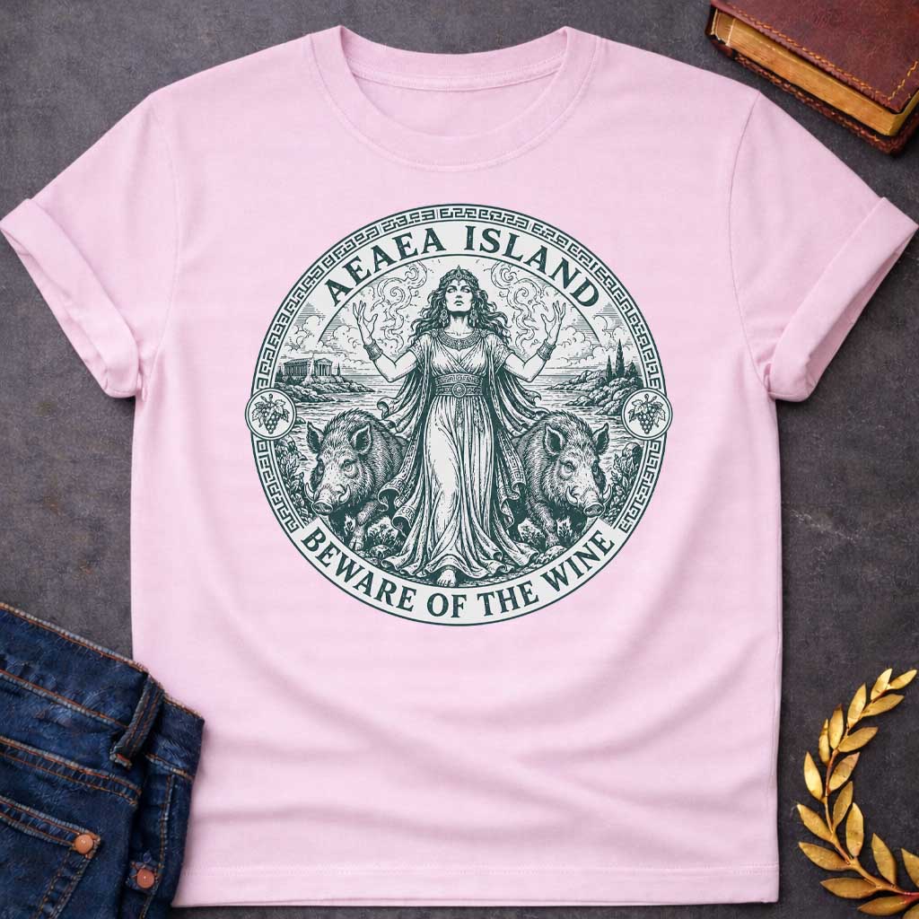 Light Pink T-shirt with a Classical engraving-style illustration of Circe, the Greek goddess of magic, commanding her island of Aeaea with raised arms and mystical power. She wears an ornate crown and flowing draped robes adorned with jewelry. Two human-headed pigs flank her, representing men transformed through her enchanted wine. Grape vines with fruit surround the mystical coastal scene. Greek key pattern border in teal frames the circular composition. Text reads 'Aeaea Island' and 'Beware of the Wine.' 