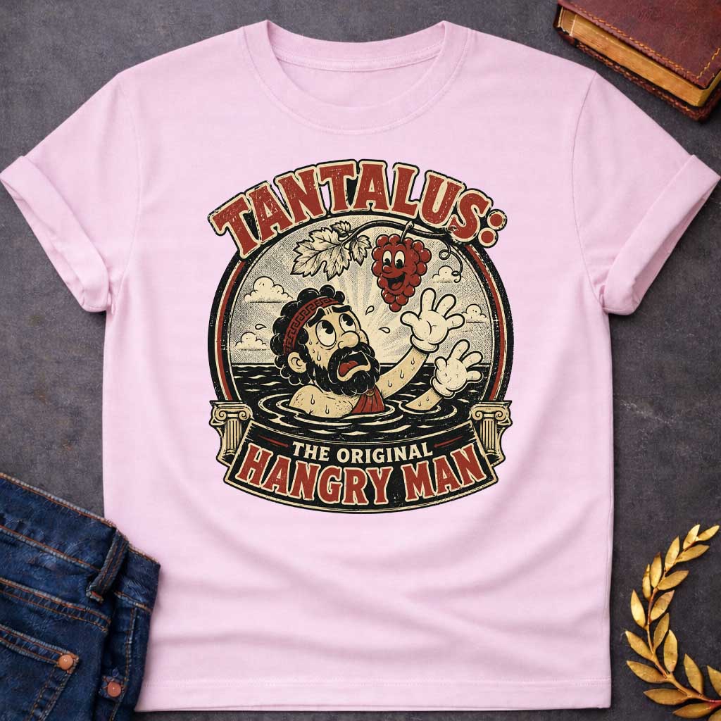 Light Pink t-shirt with A vintage 1930s rubber-hose cartoon-style graphic. Inside a circular badge flanked by Greek columns, a distressed Tantalus stands in water reaching desperately toward a smiling cartoon grape cluster dangling above him. Arched text across the top reads "TANTALUS:" while a bottom banner features "THE ORIGINAL HANGRY MAN" in a distressed red and cream color palette.