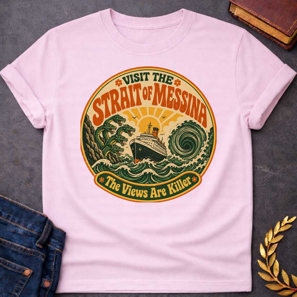 Light Pink t-shirt with A retro 70s travel-poster style design.  Inside a circular badge with a warm sunset, a vintage ocean liner sails between six-headed serpent Scylla and a swirling green whirlpool. Arched bold orange text reads "VISIT THE STRAIT OF MESSINA" at the top, while a bottom banner reads "The Views Are Killer" flanked by small flower icons in a distressed groovy aesthetic.