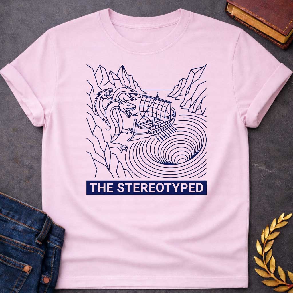 Light Pink t-shirt with A clean, line art t-shirt design. Rendered in dark blue line work, an ancient Greek galley ship navigates between a three-headed sea monster on jagged cliffs and a concentric, swirling whirlpool. Below the graphic, a solid dark blue rectangular banner features white, sans-serif block text that reads "THE STEREOTYPED".