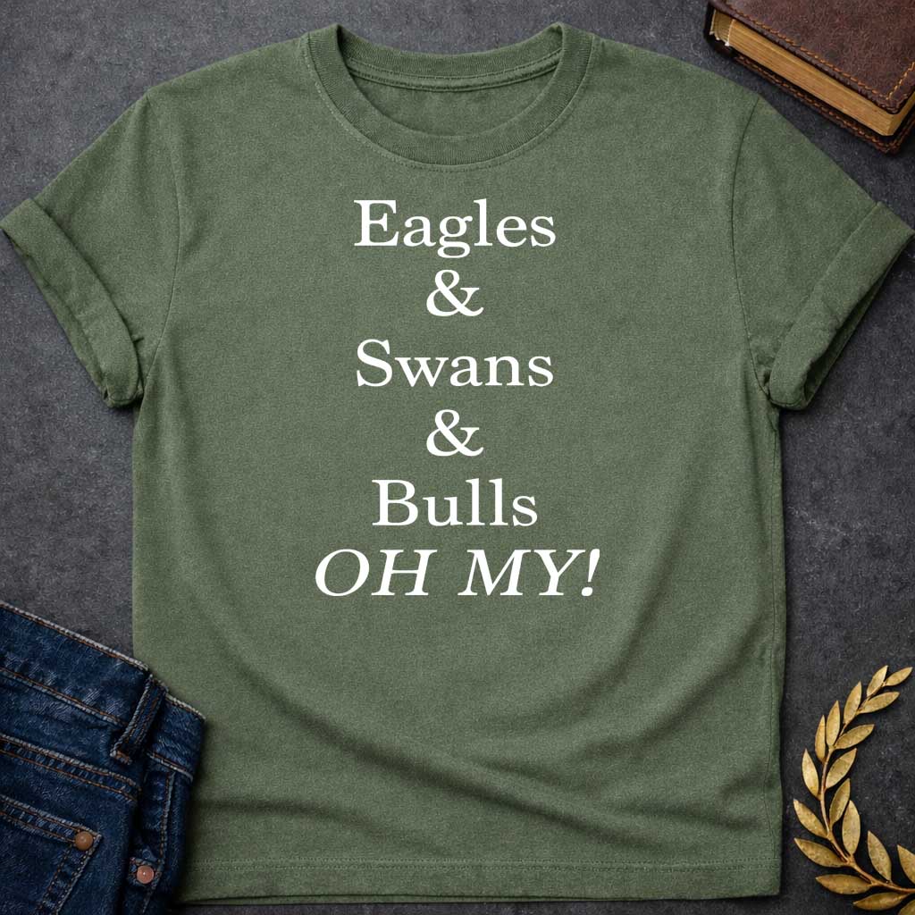 Military Green T-shirt graphic in white featuring large bold serif text reading "Eagles & Swans & Bulls OH MY!" — a humorous parody of the "Lions and Tigers and Bears, Oh My!" phrase from The Wizard of Oz, referencing the many animal disguises Zeus used for his romantic pursuits in Greek mythology
