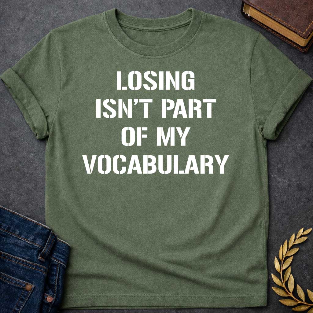Military Green Black T-shirt graphic in white featuring bold military stencil-style text reading "Losing Isn't Part of My Vocabulary" — a motivational phrase referencing Ares, the Greek God of War